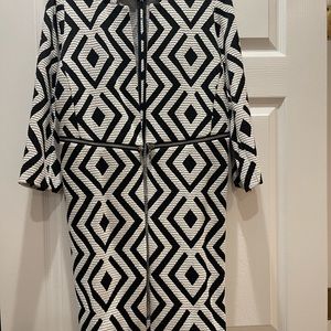 Chico’s black and white geometric topper with zipper details